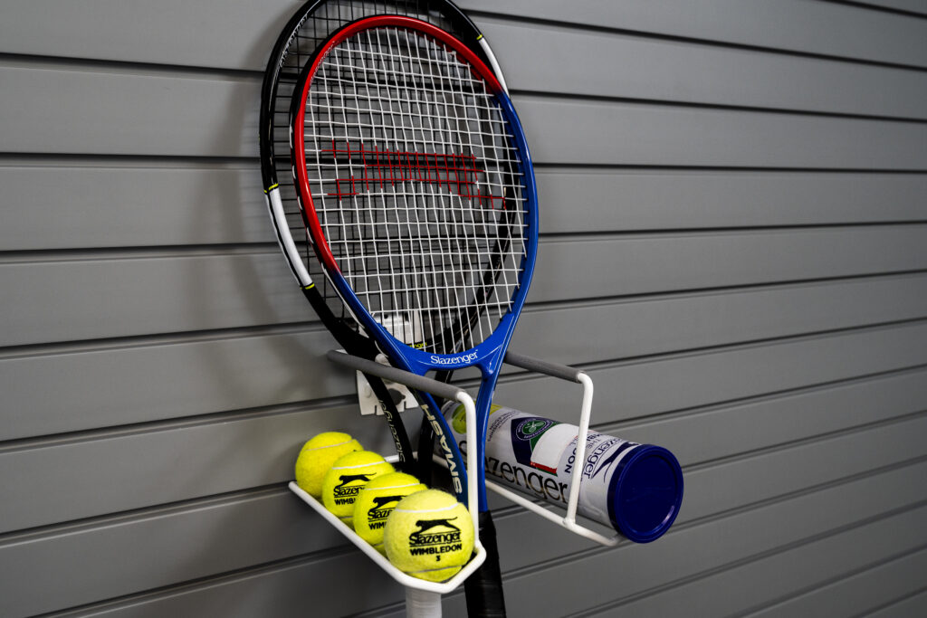 tennis racket holder on slatwall