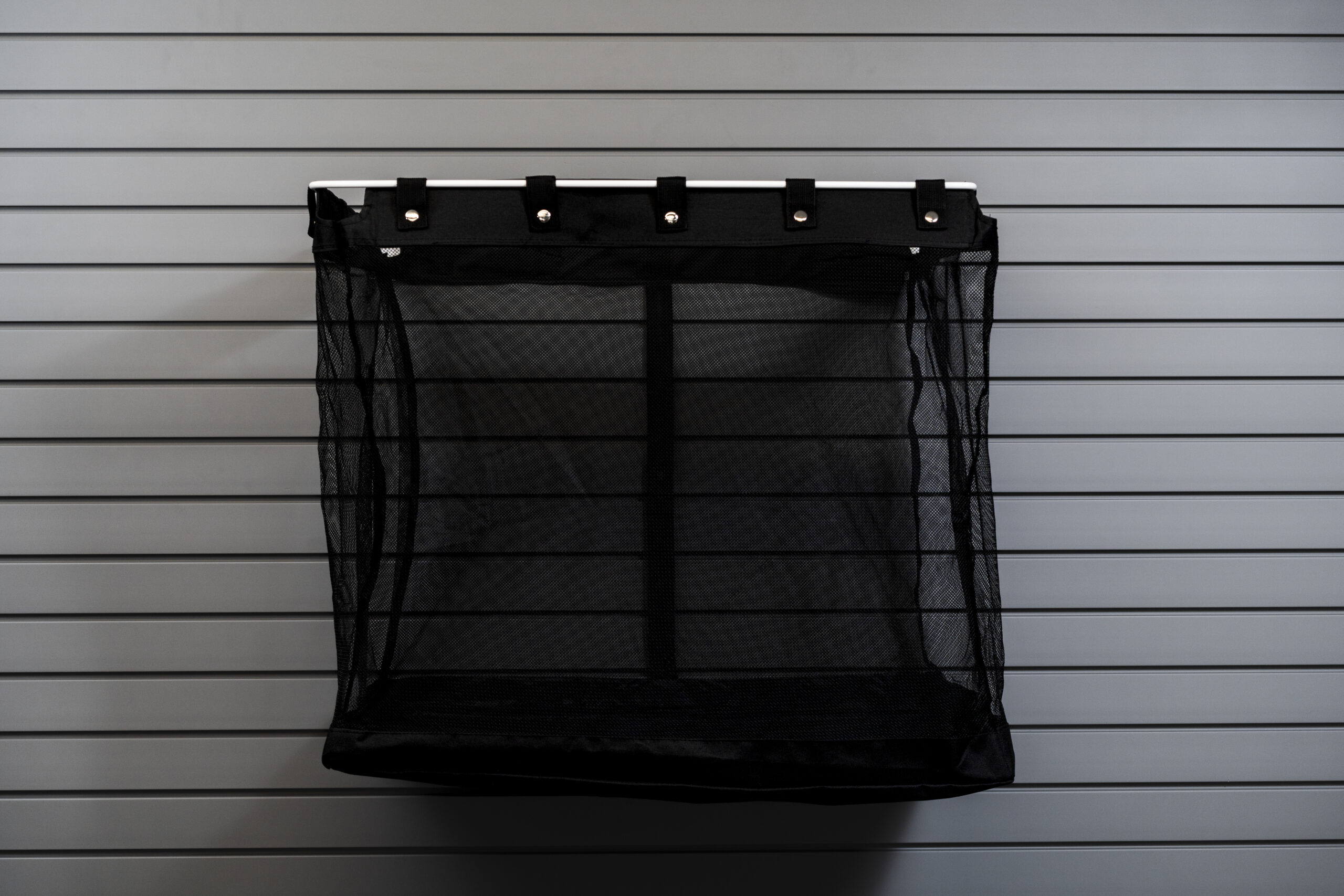 Deep mesh storage basket on slatwall