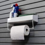 paper towel rack holding cleaning products